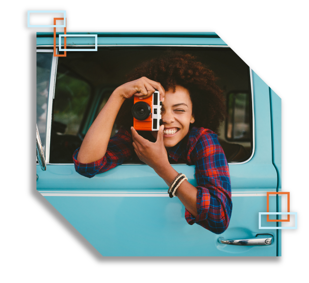 Girl in car taking a photo.