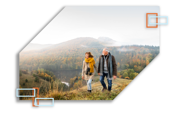 Couple hiking in mountains in the fall.