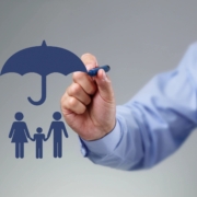 An illustration of a family under an umbrella.