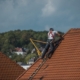Contractor fixing a roof.
